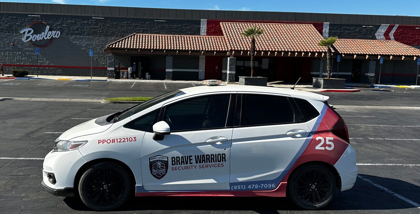 Brave Warrior Security Services patrol vehicle providing commercial and entertainment venue security at a parking lot